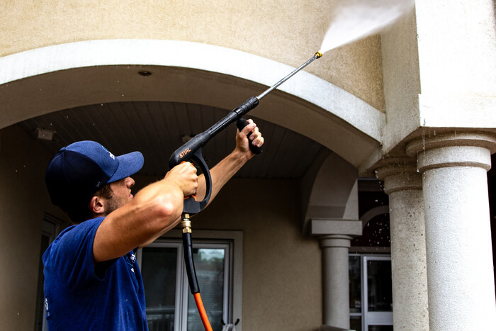 Edmonton pressure washing expert at work on a commercial building